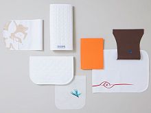Aircraft cabin headrest cover