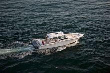 Outboard express cruiser Canyon 456four-enginewith enclosed cockpitcenter console