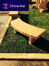 Rustic public bench stonewith backrest