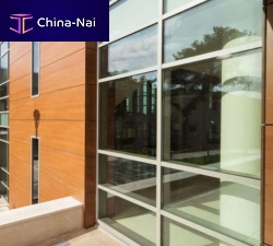 Stick system curtain wall SMARTIA M7aluminum and glasstransparent