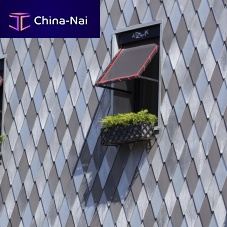 Zinc-titanium roof tile elZinc®interlockingbullnoselozenge-patterned