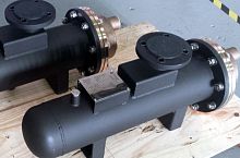 Shell and tube heat exchanger for ships