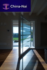 Interior door ONEwoodenpivoting with offset axisglazed