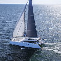 Catamaran sailing yacht R5cruisingwith open transomwith bowsprit