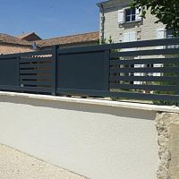 Fence with panels Ajourelouveredwith barsresidential
