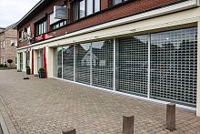 Retractable security grill for doors