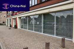 Retractable security grill for doors