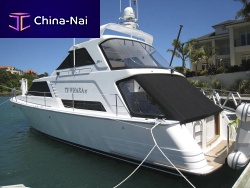 Inboard express cruiser Te Whara IIItwin-enginedisplacement hullwith enclosed flybridge