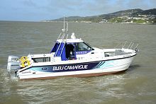 Catamaran express cruiser Bleu Camargueoutboardtwin-enginewith enclosed cockpit