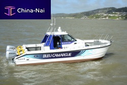 Catamaran express cruiser Bleu Camargueoutboardtwin-enginewith enclosed cockpit