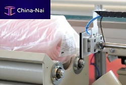 Self-adhesive label printer-applicator fabric rollfor textiles